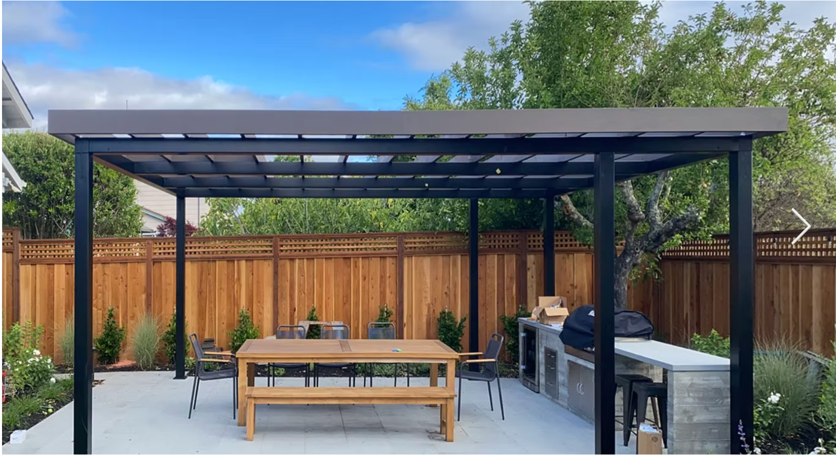 Modern pergola with outdoor dining and kitchen