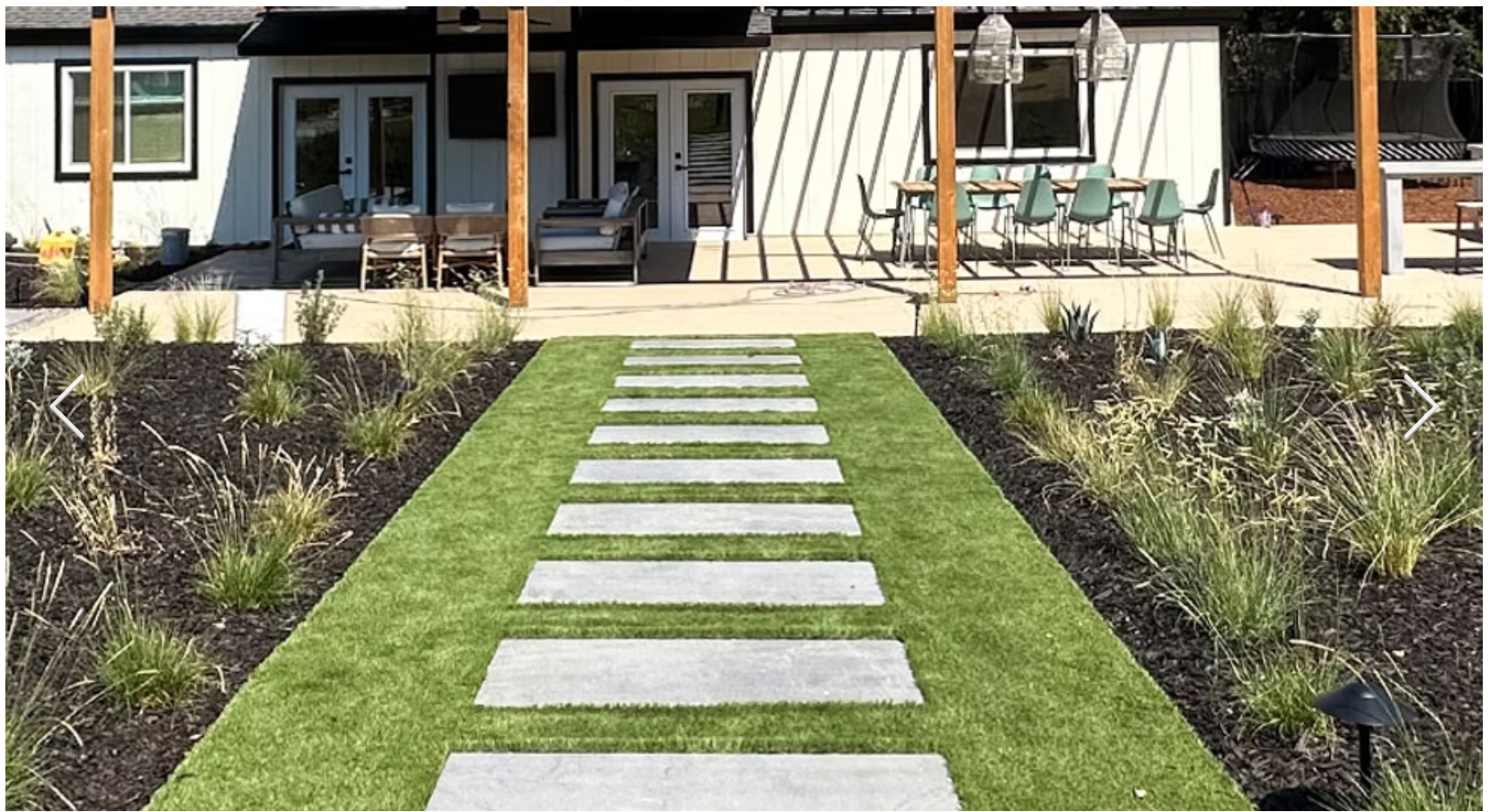 Stepping stone pathway through lush landscaping